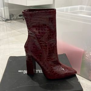 Brand new never worn. Pretty little thing burgundy heeled boots. Faux snakeskin